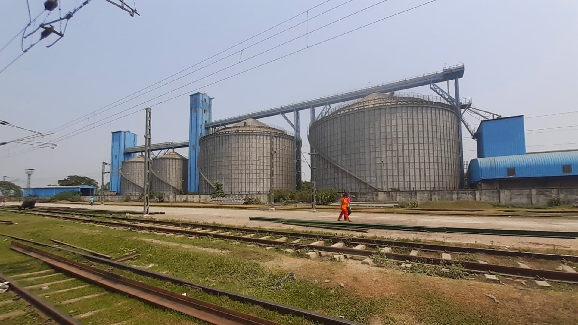 A large food processing plant building and silos